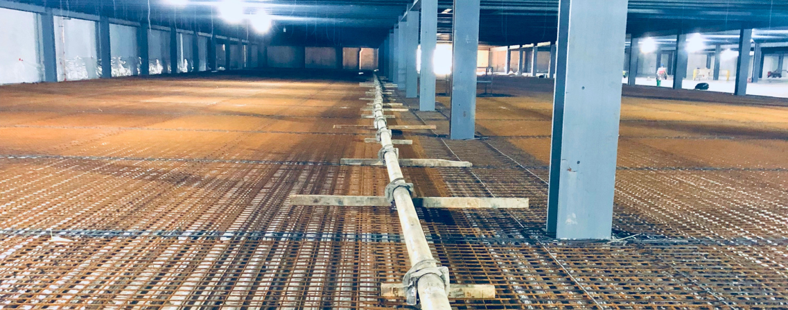 Concrete pump pipe riser installed on an Indian jobsite