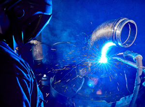 Con Forms welder fabricating a pipeline section on the shop floor