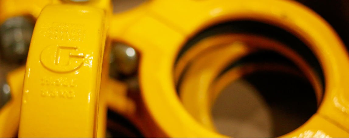 Concrete pump pipe couplings and clamps installed on pipe