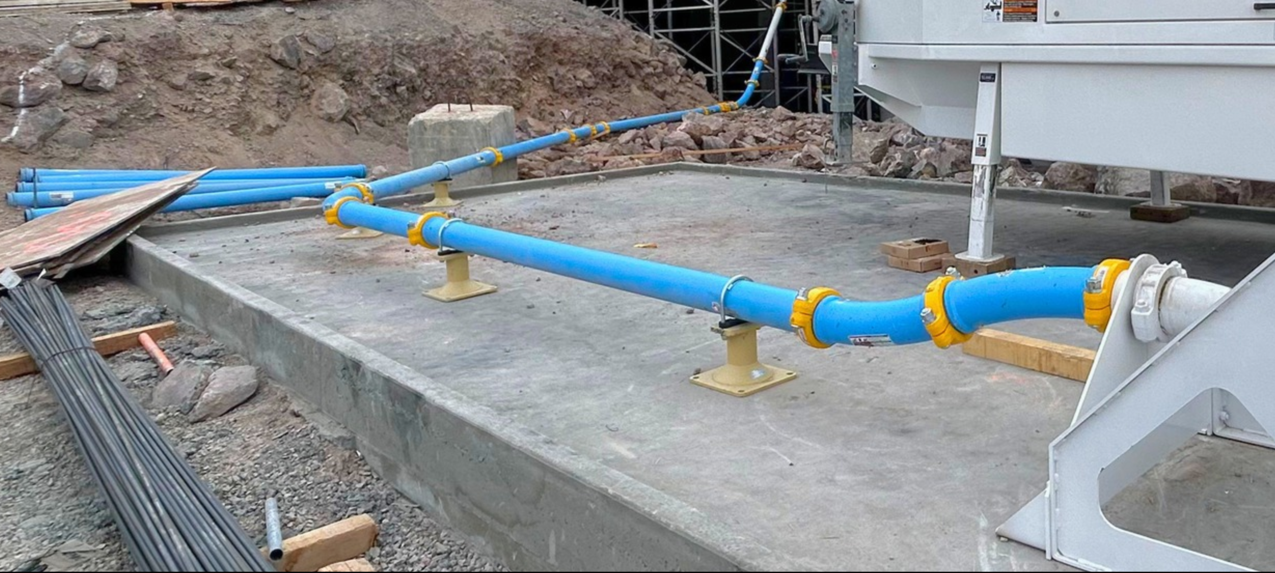 Concrete pump line and pipe supports on a residential jobsite
